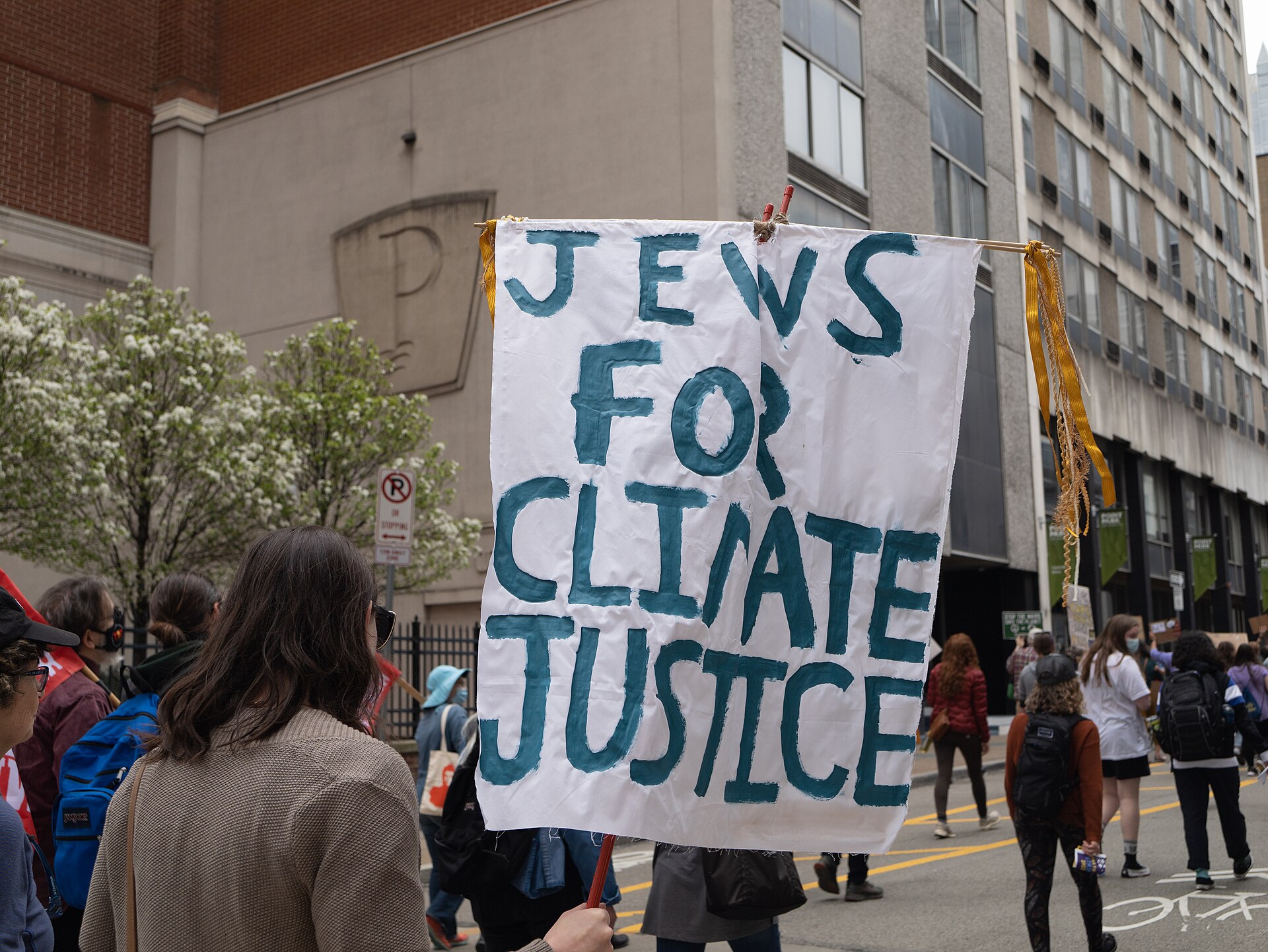 People at a climate and environmental-justice strike with signs