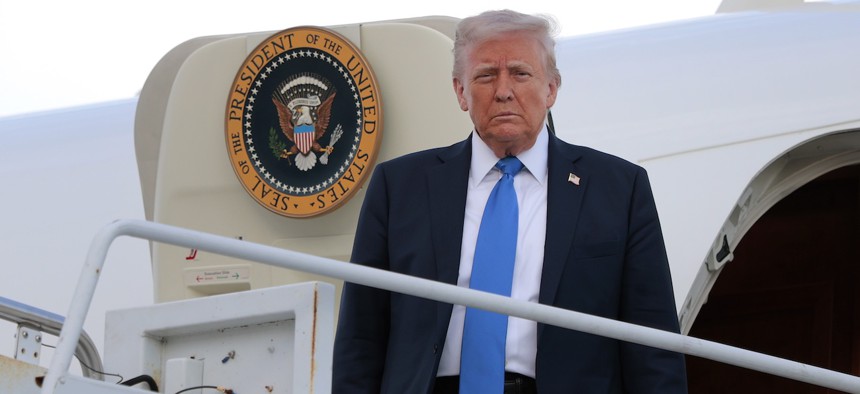 President Donald Trump descending Air Force One — his budget proposes deep cuts to HBCUs, SNAP, and Head Start