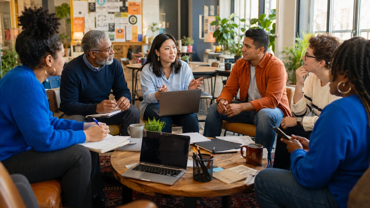 Partners collaborating around a table